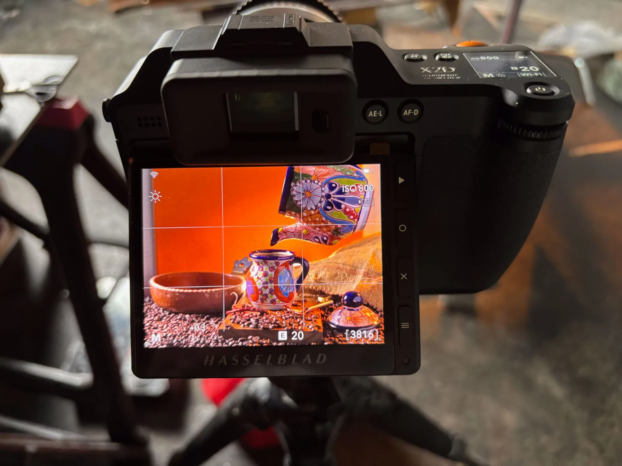 Close-up of a camera LCD screen showing a colorful plated food shot on set - Raging Bull Food Photography